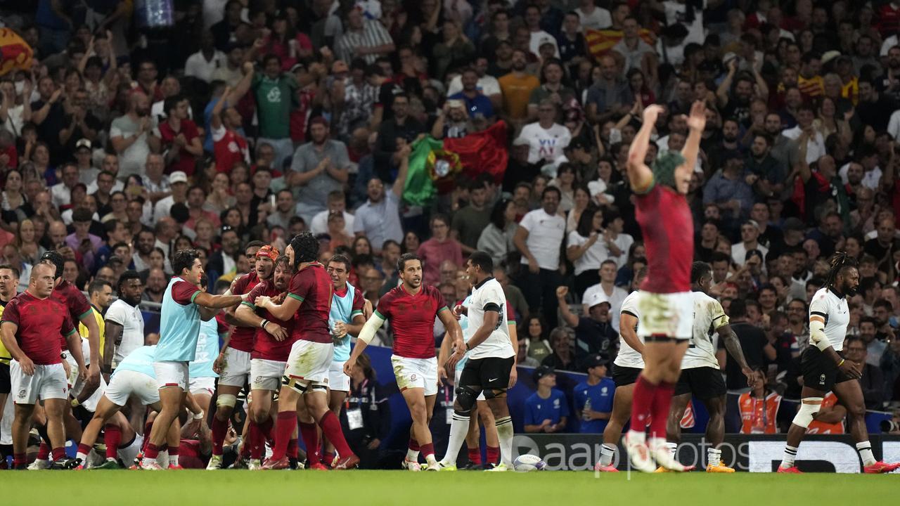 Portugal celebrate a try against Fiji at Rugby World Cup.