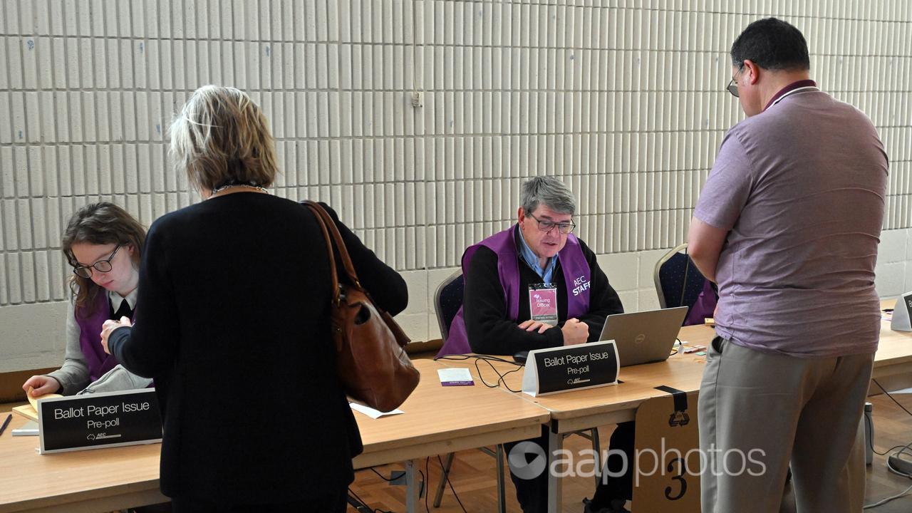 Voters and Australian Electoral Commission staff (file image)