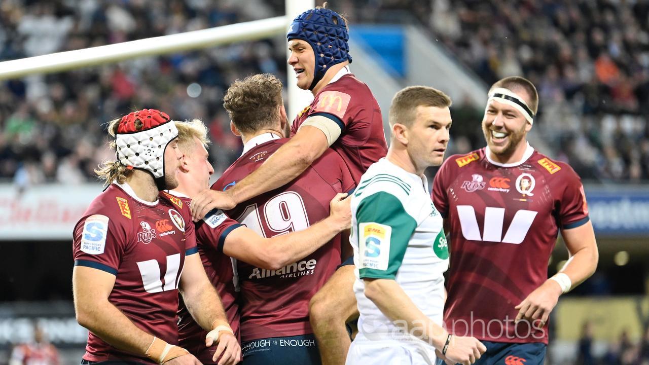 Queensland Reds players celebrate.