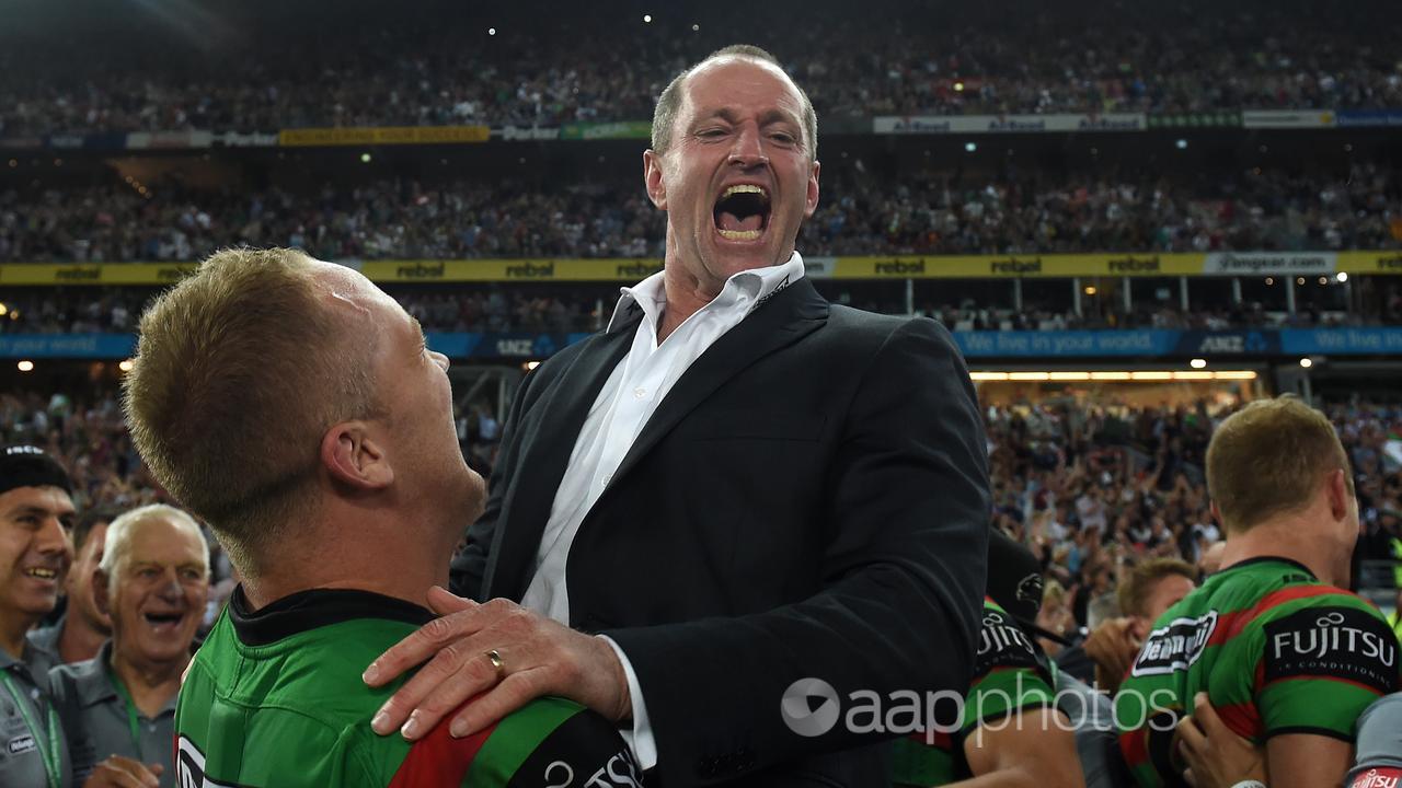 Michael Maguire celebrates South Sydney's 2014 premiership.