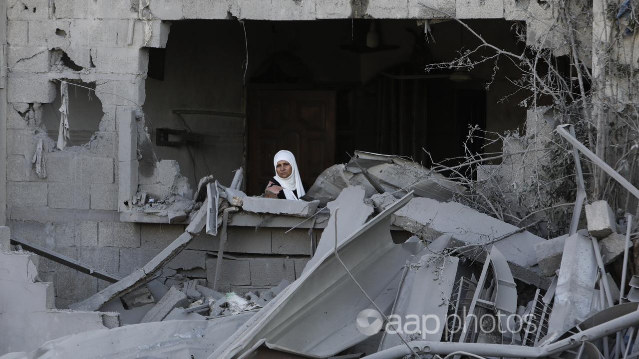 A Palestinian woman after an Israeli strike on the Gaza Strip
