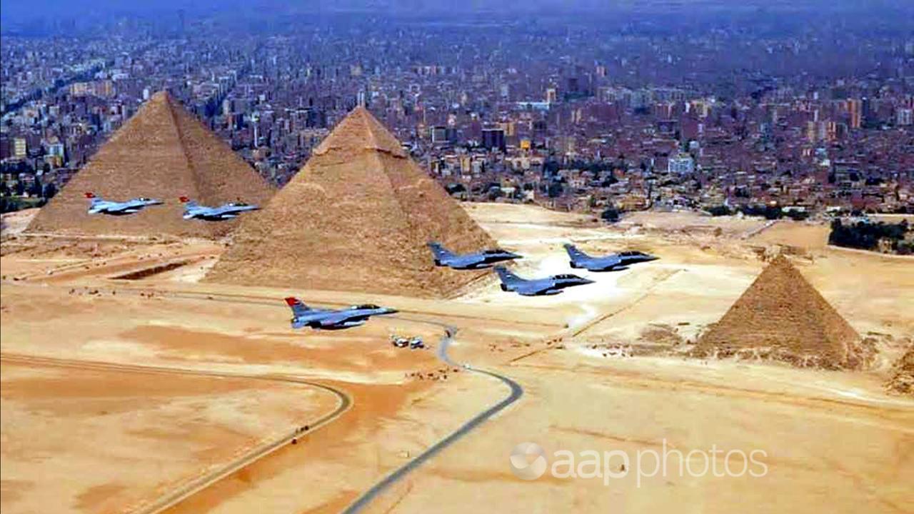 Egyptian Rafael fighter jets flying over the Great Pyramids in Cairo.