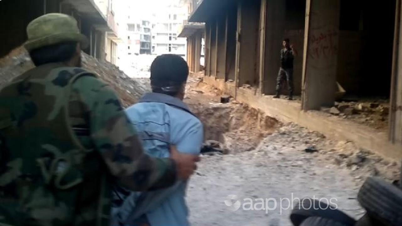 A still image from the Syrian video of the 2013 massacre of civilians