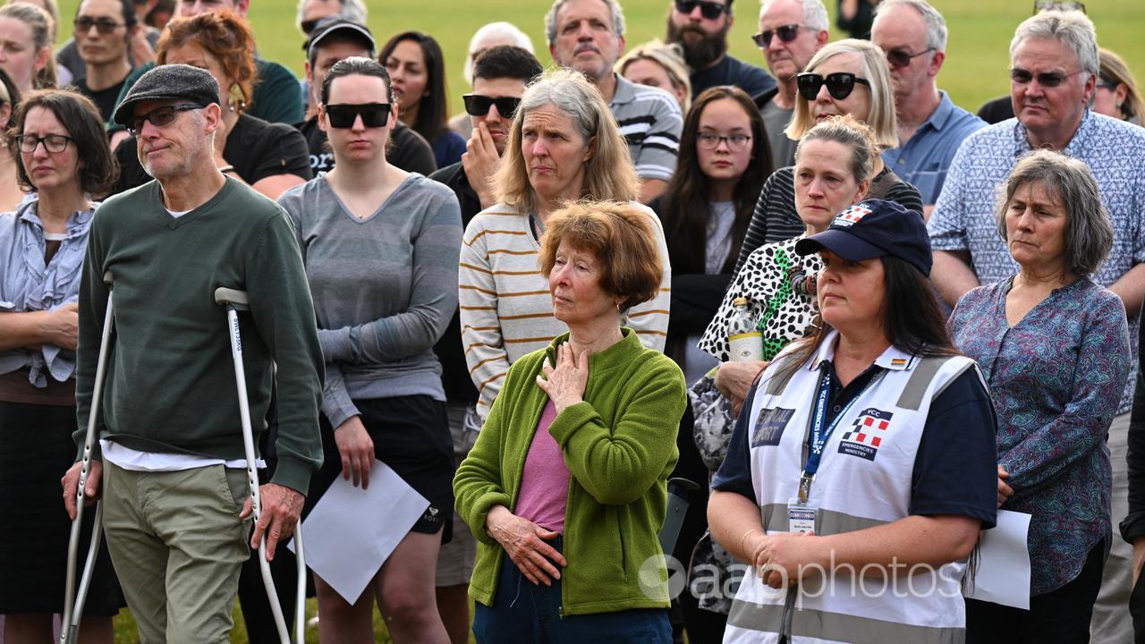 Mourners gather for a vigil at Victoria Park