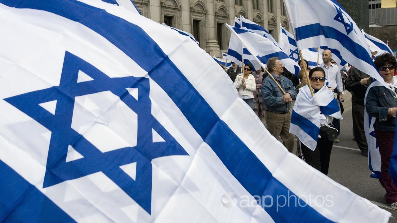 People march with the Israeli flag (file image)