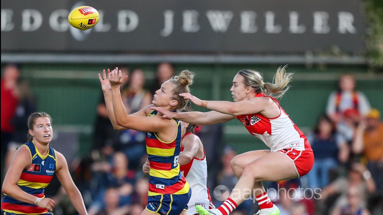Zoe Prowse and Laura Gardiner in action in the first AFLW semi-final.