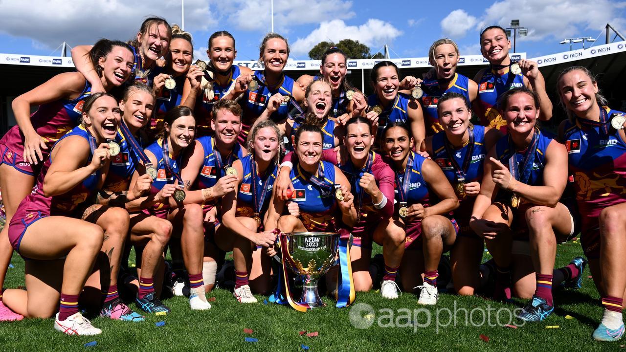 Brisbane Lions players celebrate winning the AFLW grand final