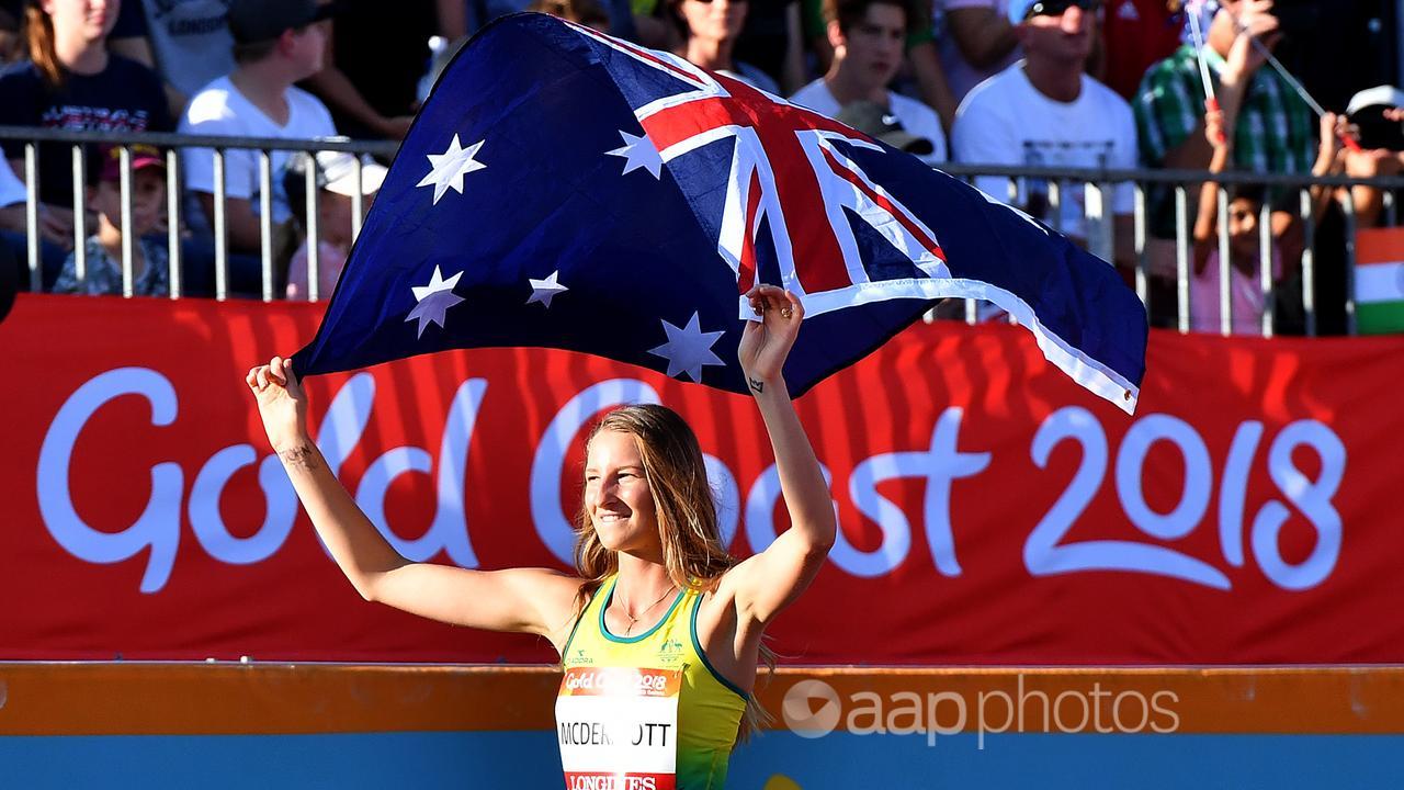 Nicole McDermott of Australia celebrates with flag at Gold Coast 2018.