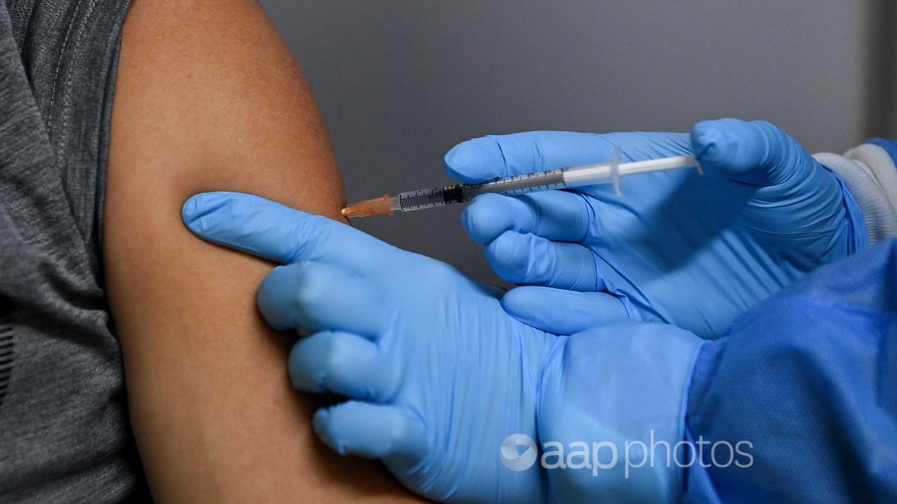 A person receives a COVID-19 vaccination (file image)