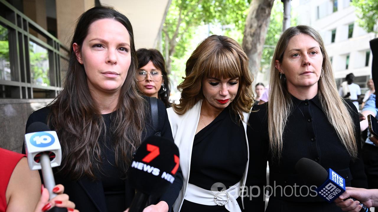 Emma Walters (2nd right) leaves the Melbourne Magistrates Court