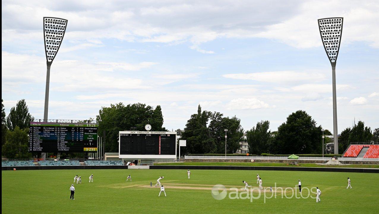 Action between the PM's XI and Pakistan at Manuka Oval.