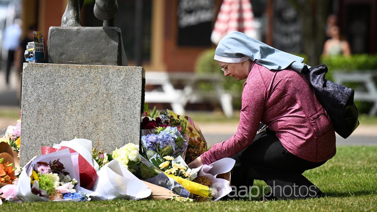 A nun lays tribute to the crash victims (file image)