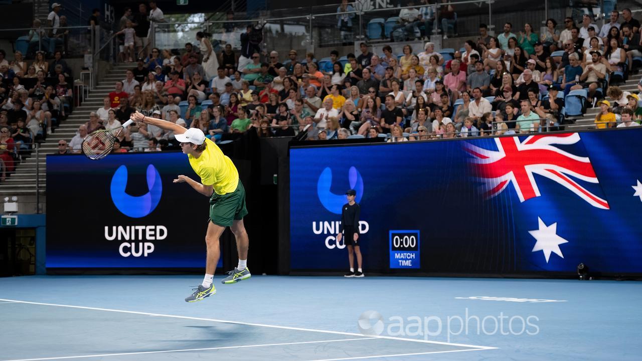 Alex de Minaur serves against Rafael Nadal in Sydney.