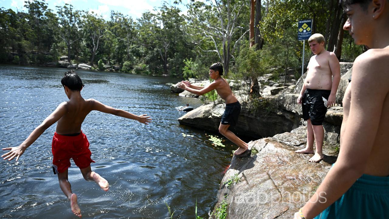Boys at Lake Parramatta west of Sydney cool off in the heat.
