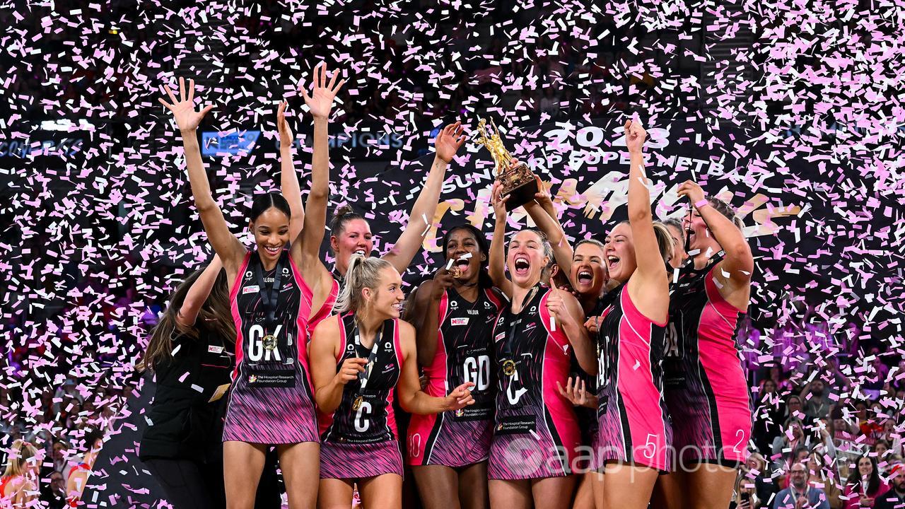 Adelaide Thunderbirds players celebrate Super Netball grand final win.