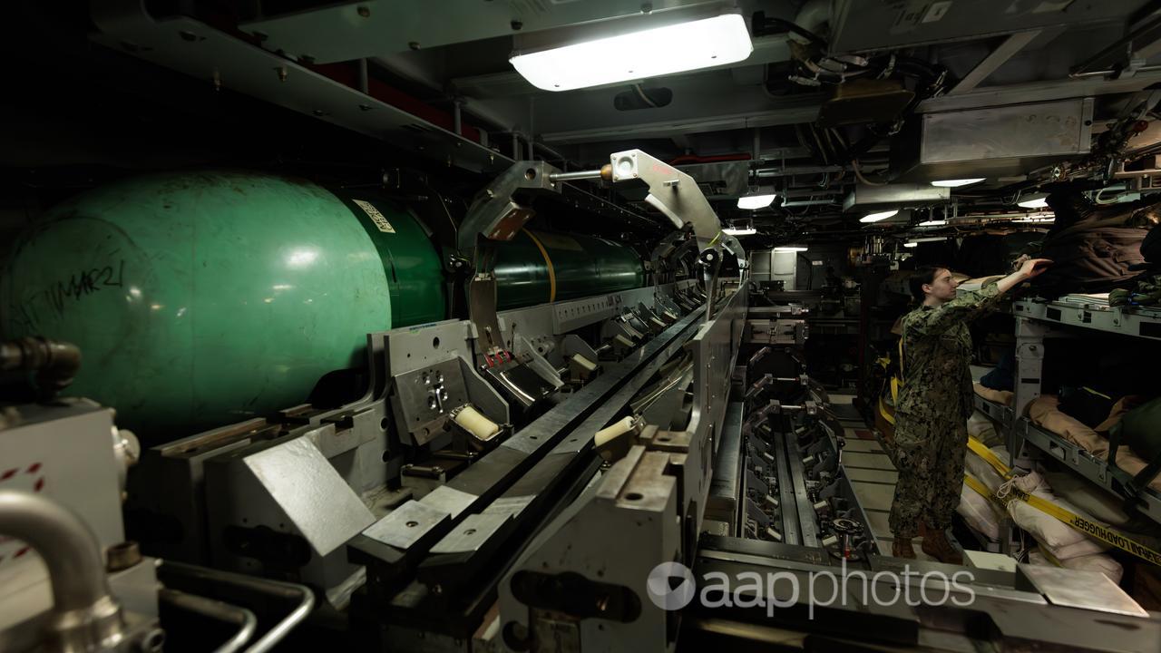 Crew member inside a Virginia-class submarine.