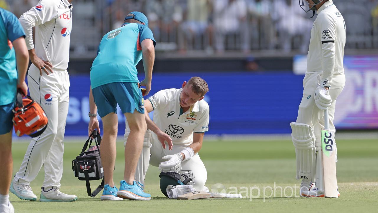 Marnus Labuschagne receives medical attention to his hand