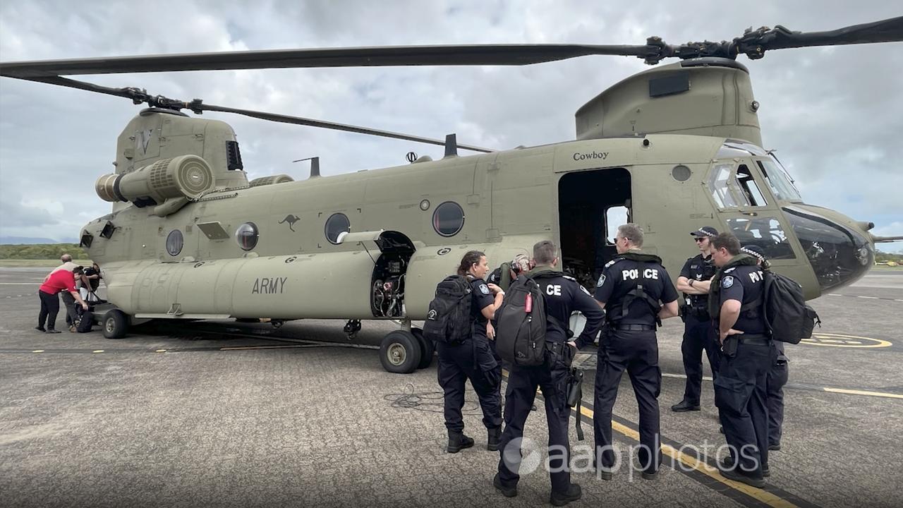 Officers about to board an ADF Chinook to assist recovery efforts