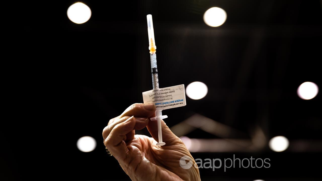 A syringe with a COVID vaccine (file image)