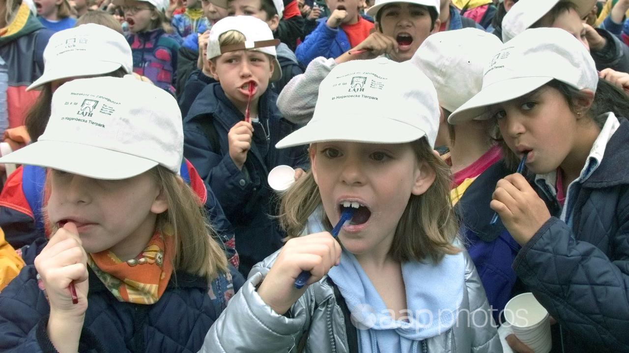 Children brush their teeth for a competition in Germany.