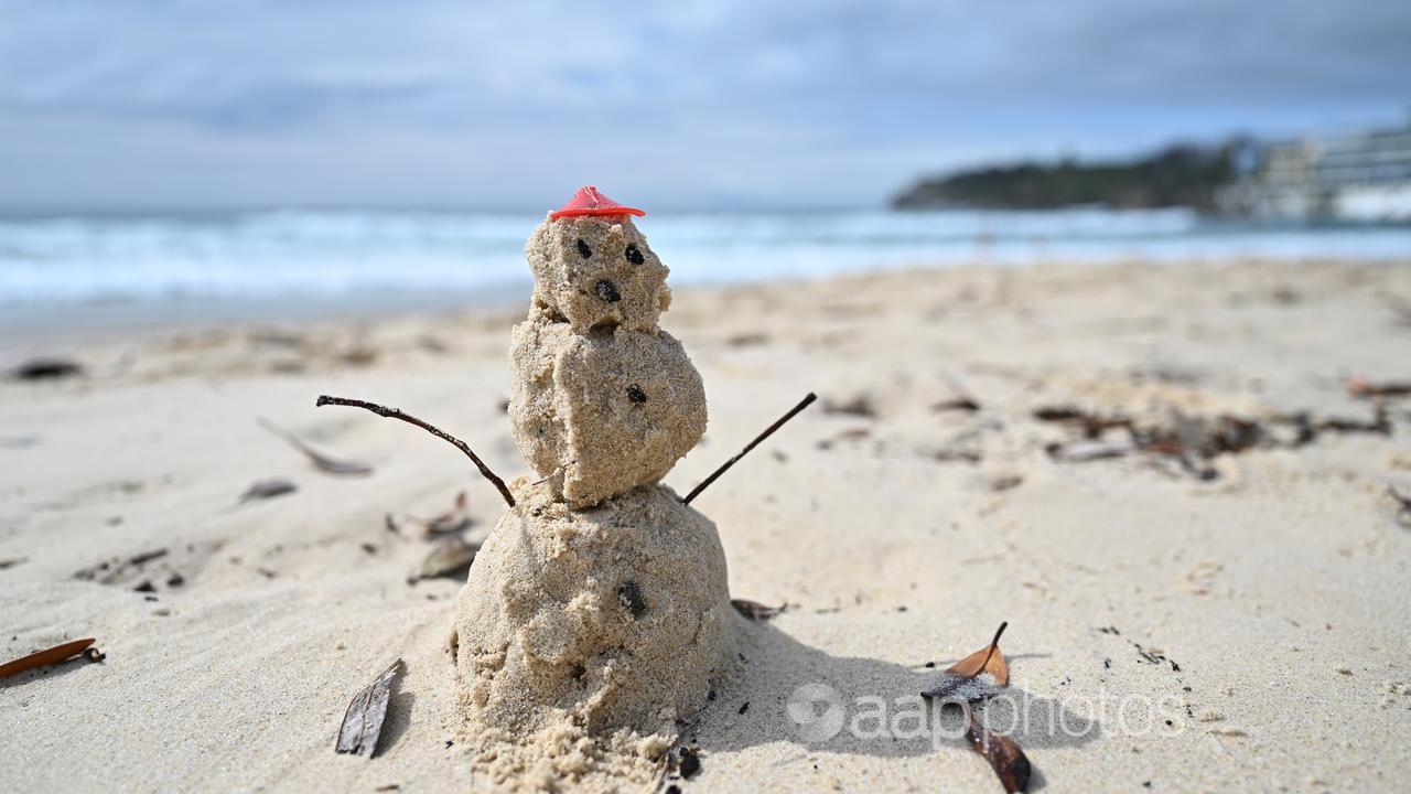 Snowman made of sand at Bondi Beach.