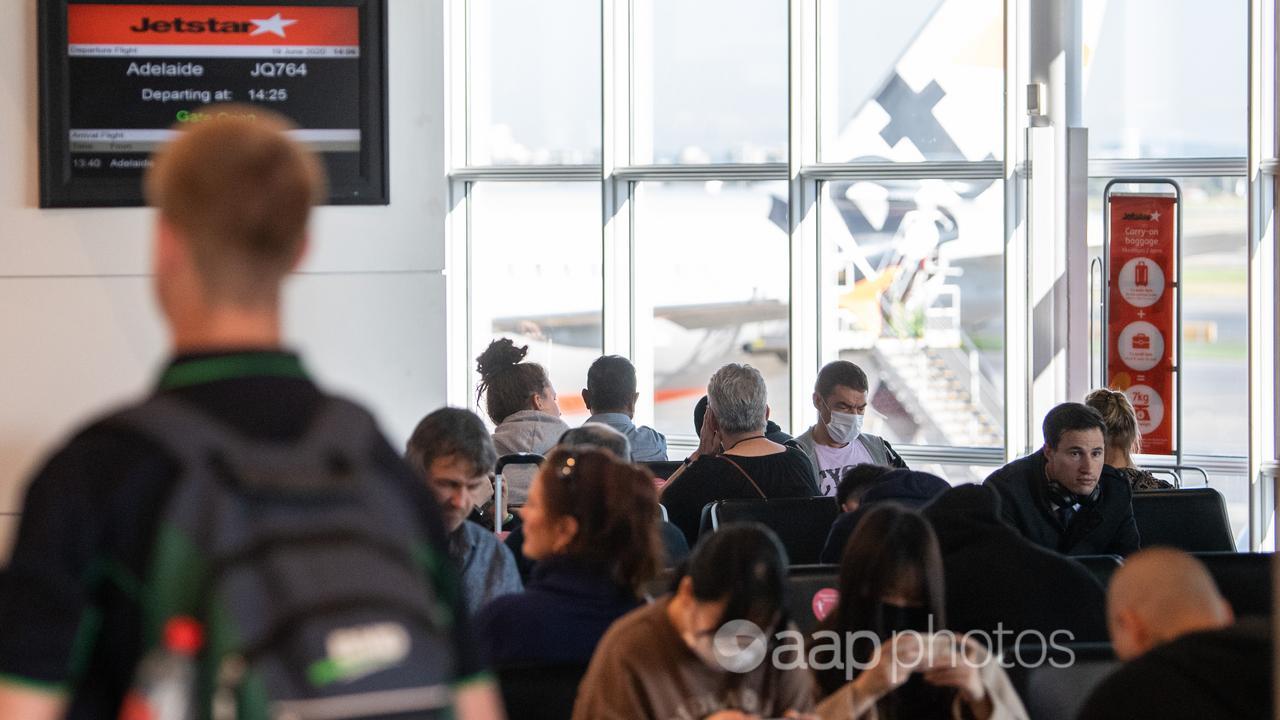 Passengers waiting to board a Jetstar flight at Sydney Airport