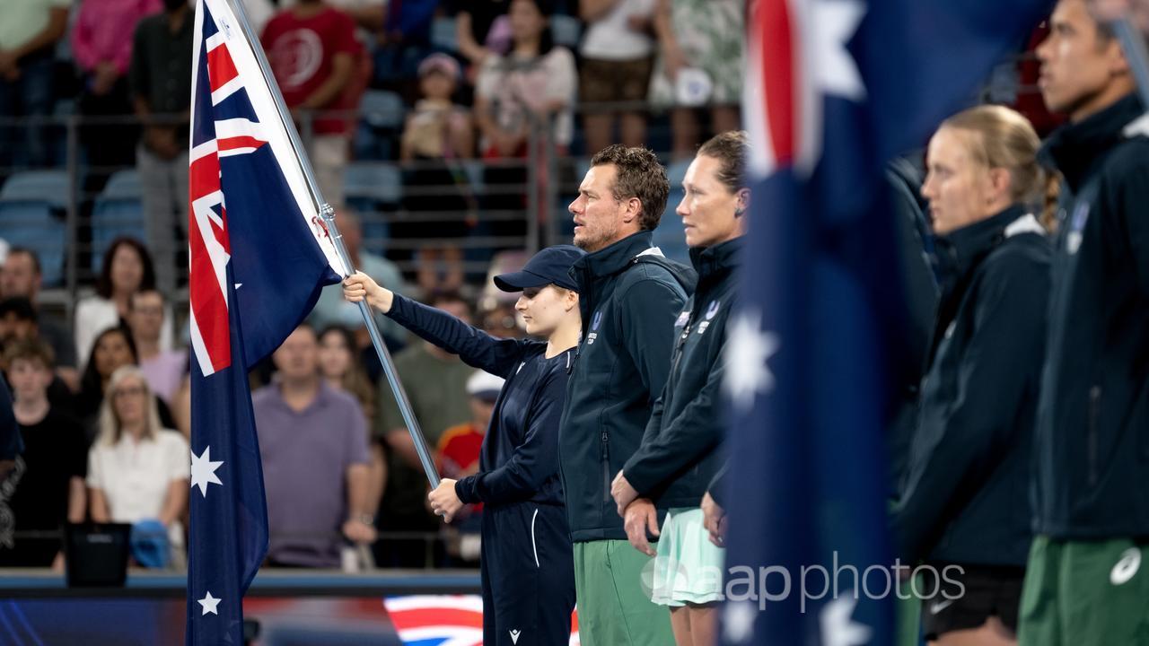 Australian coach Lleyton Hewitt (centre)