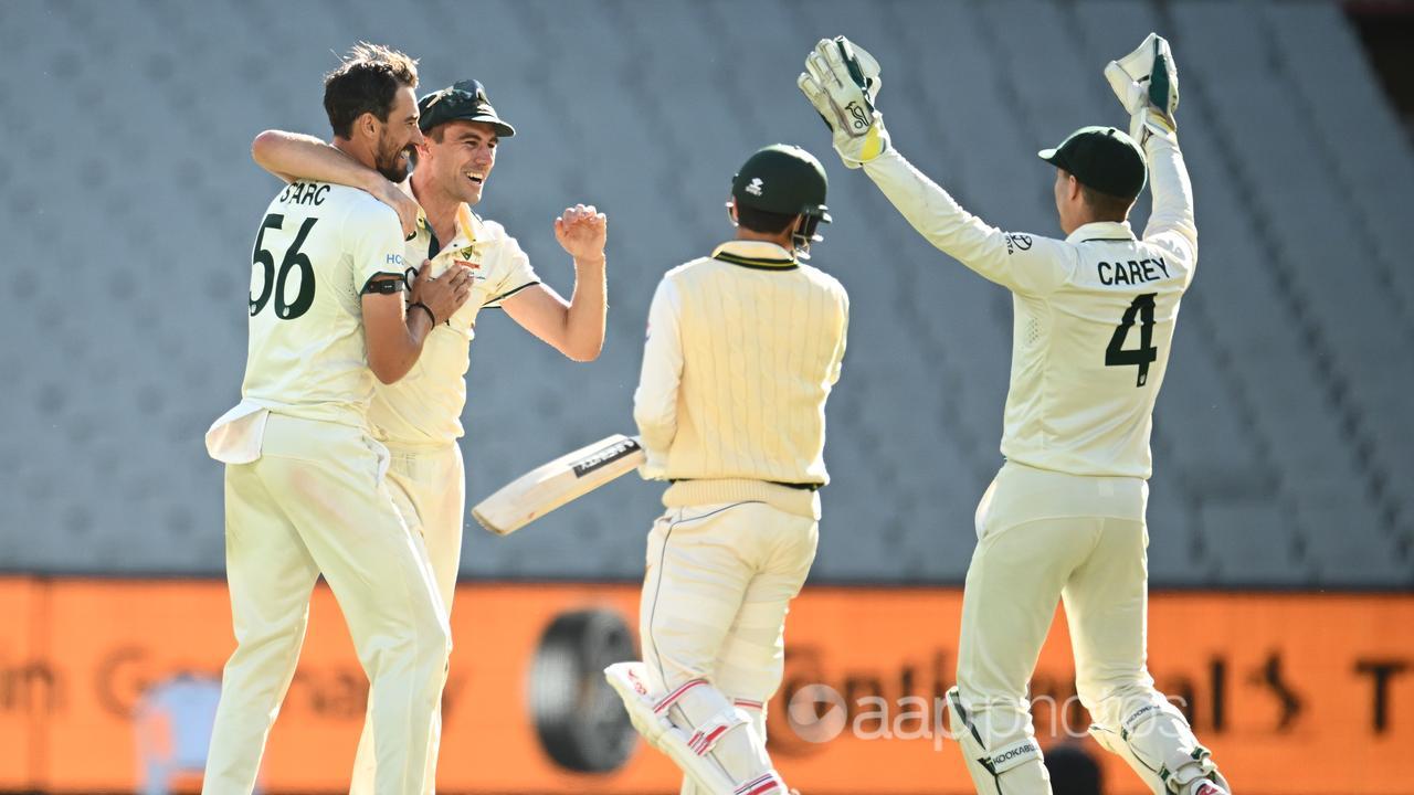 Australia players celebrate the win over Pakistan.