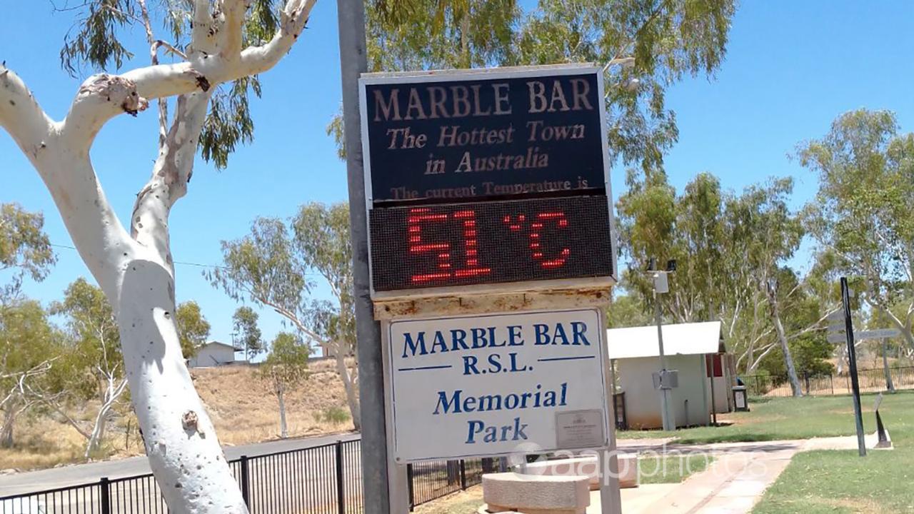 A sign at Marble Bar, WA, shows how hot it is.