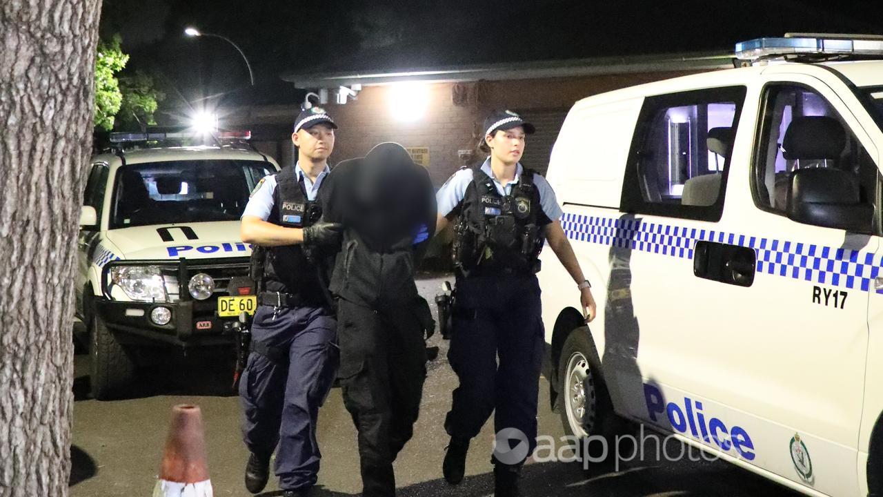NSW police arrest a man in relation to a murder in Bondi Junction.