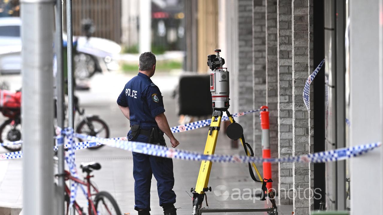 Police officer at the scene of a shooting in Bondi Junction.