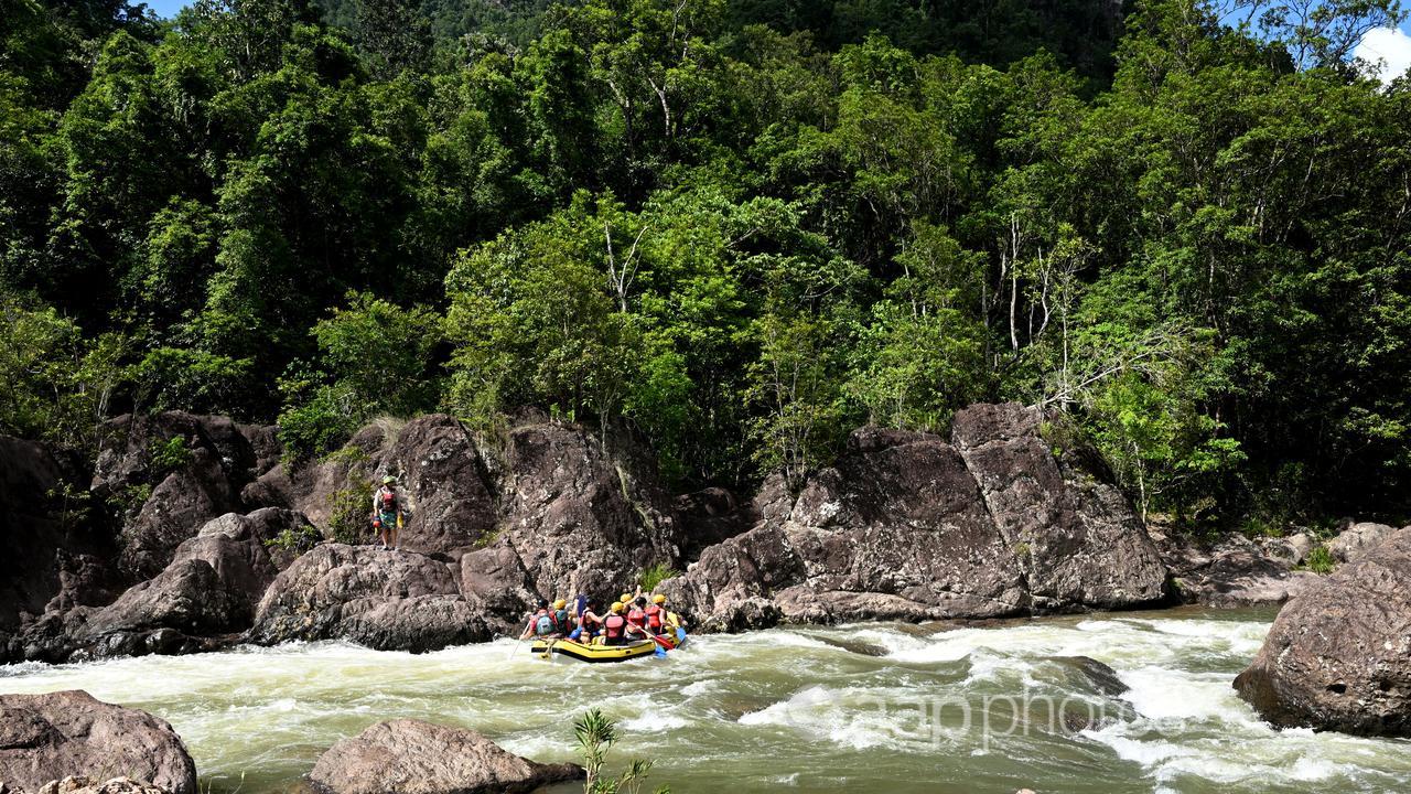 Tourists white water rafting on the Tully River in North Queensland