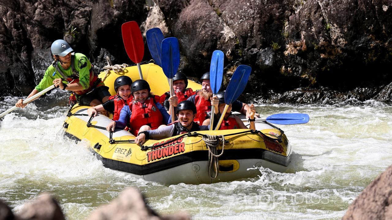Tourists white water rafting on the Tully River in Qld