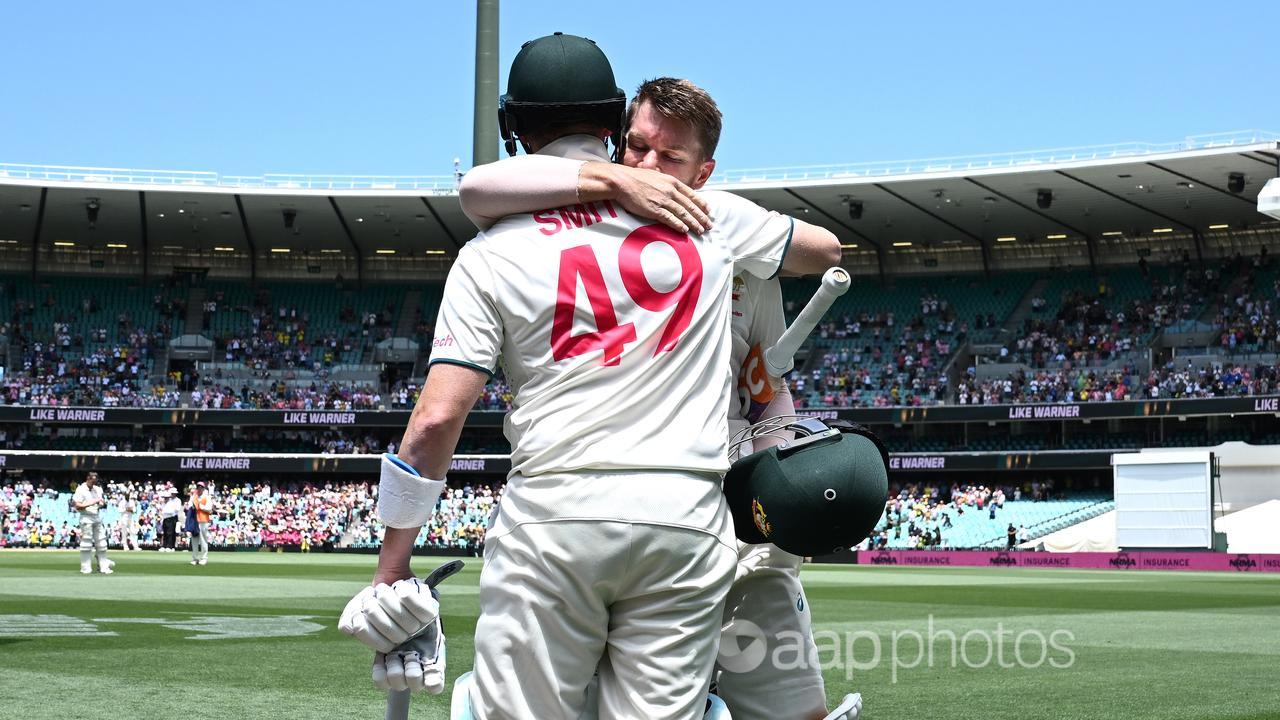 David Warner is embraced by his long-term teammate Steve Smith.