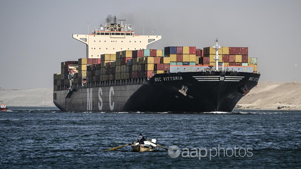 A container ship crosses the Suez Canal towards the Red Sea in Egypt.