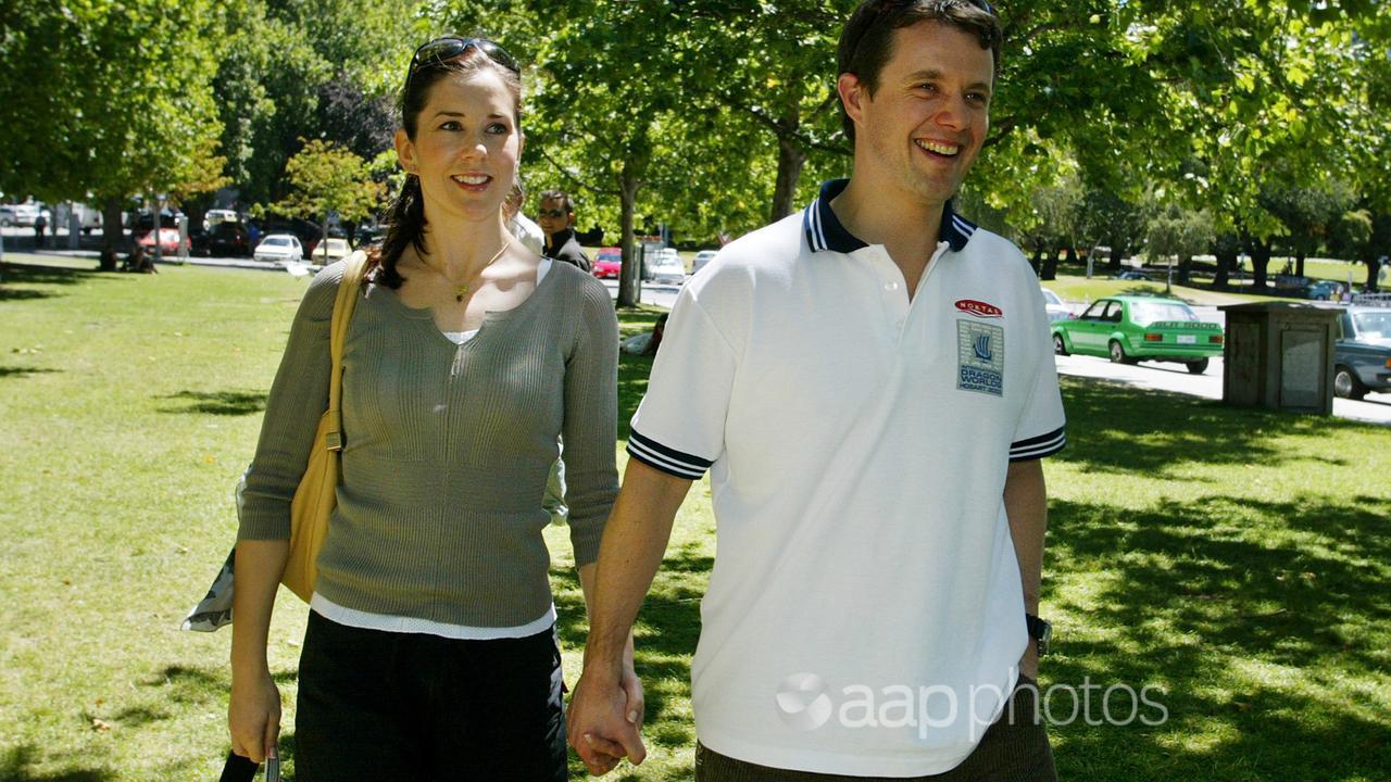 Frederik right, walks with his Australian fiancee Mary Donaldson