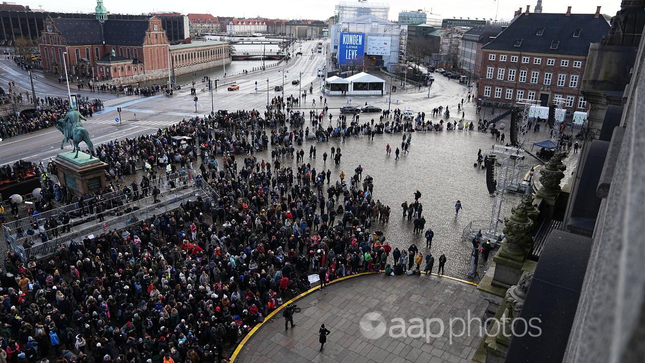 People gather at the Christiansborg Castle square in Copenhagen