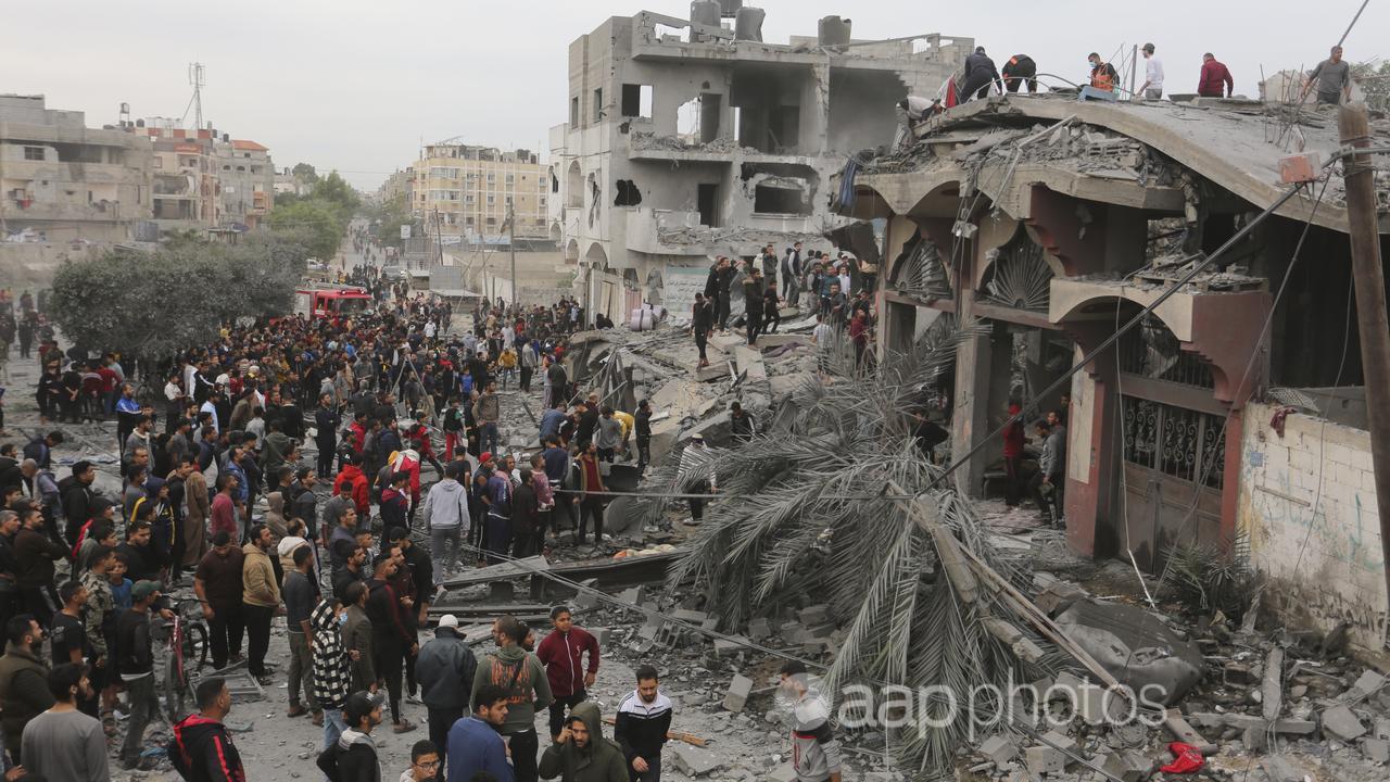 Palestinians search for survivors of the Israeli bombing in Gaza