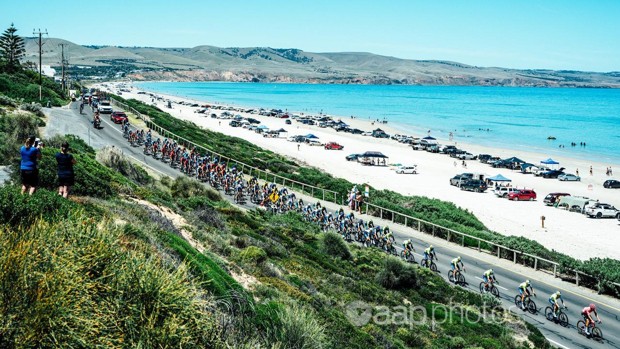 The peloton skirts the beach during stage five of the Tour Down Under.