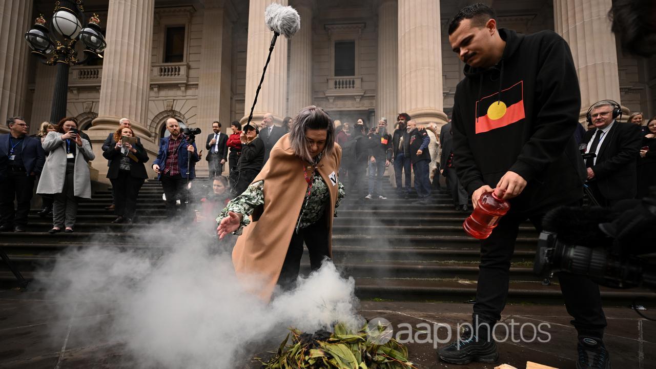 A smoking ceremony on the steps of Victorian Parliament 