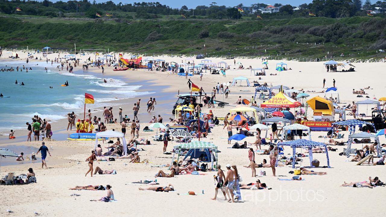 Beachgoers are seen at Maroubra Beach, Sydney