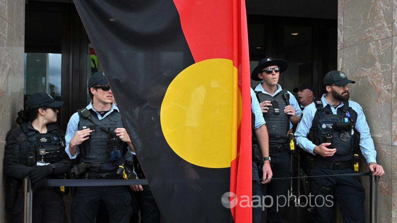 Police keep watch during an Invasion Day in Canberra.
