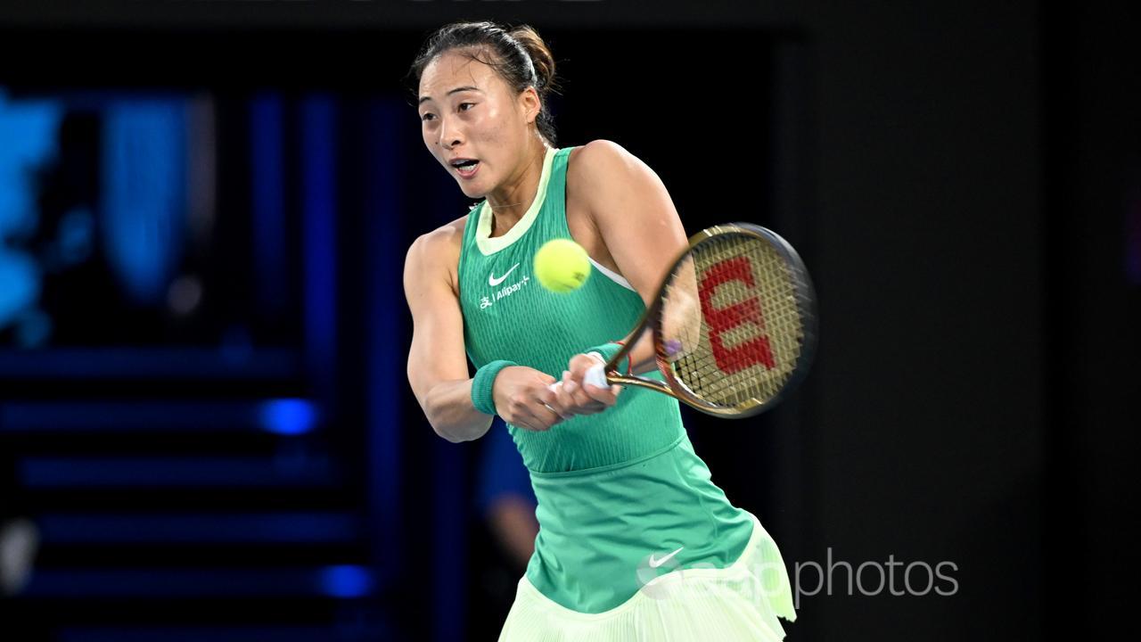 Zheng Qinwen returns during the AO final. 
