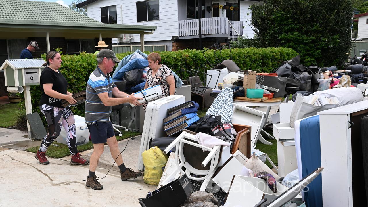 Residents leaning up their flood damaged properties