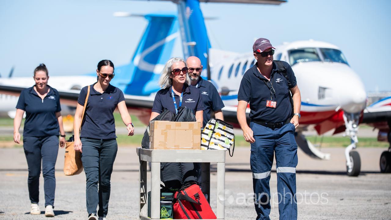 Royal Flying Doctor Service crew on the tarmac at Broken Hill.