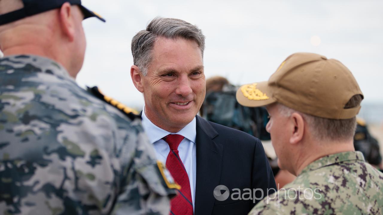 Defence minister Richard Marles speaking with US personnel in WA