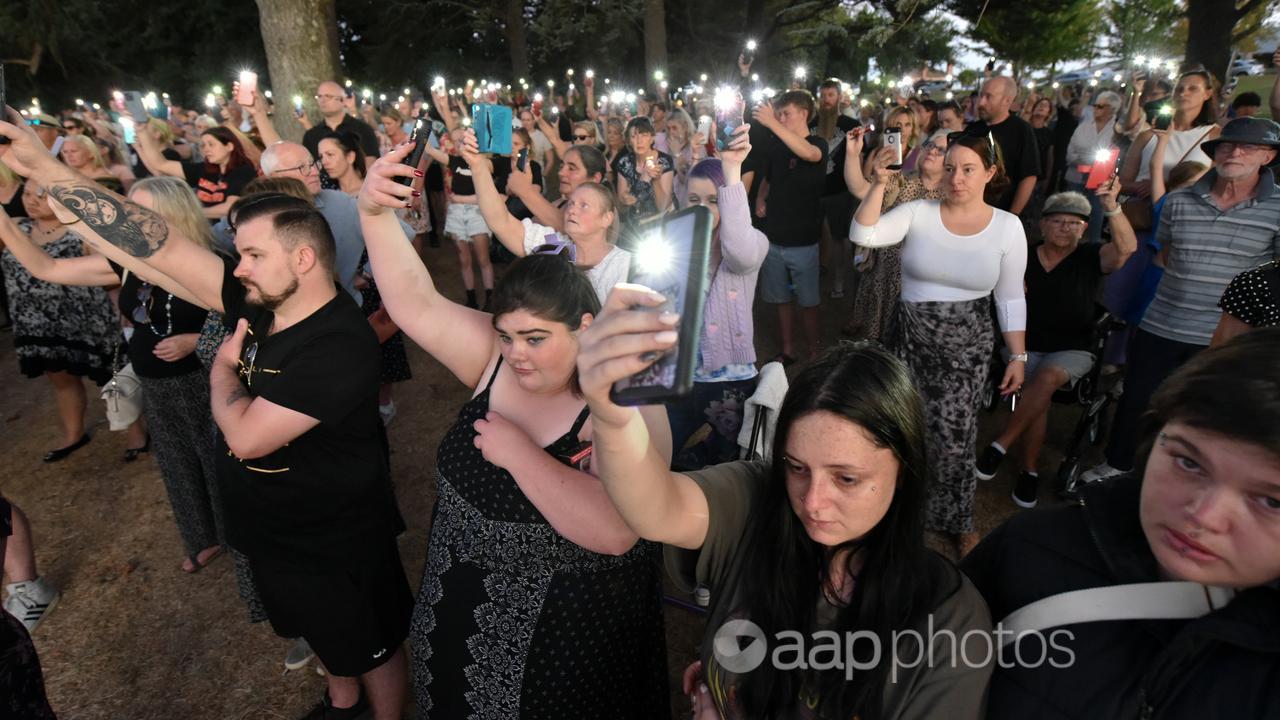 Mourners pay tribute to Samantha Murphy at a vigil