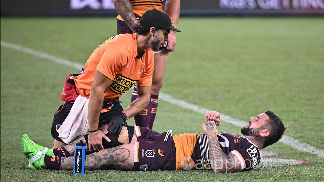 Brisbane's Adam Reynolds receives treatment against Souths.