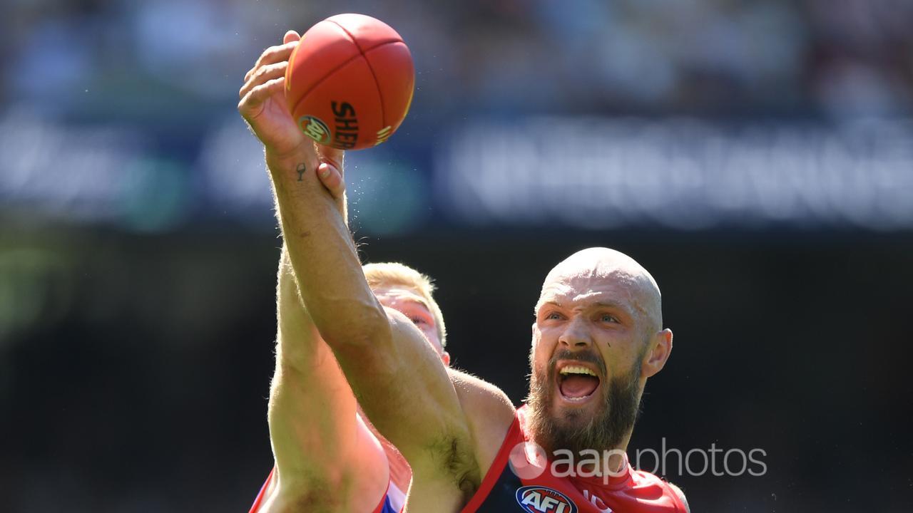 Max Gawn and Tim English contest a ruck duel.