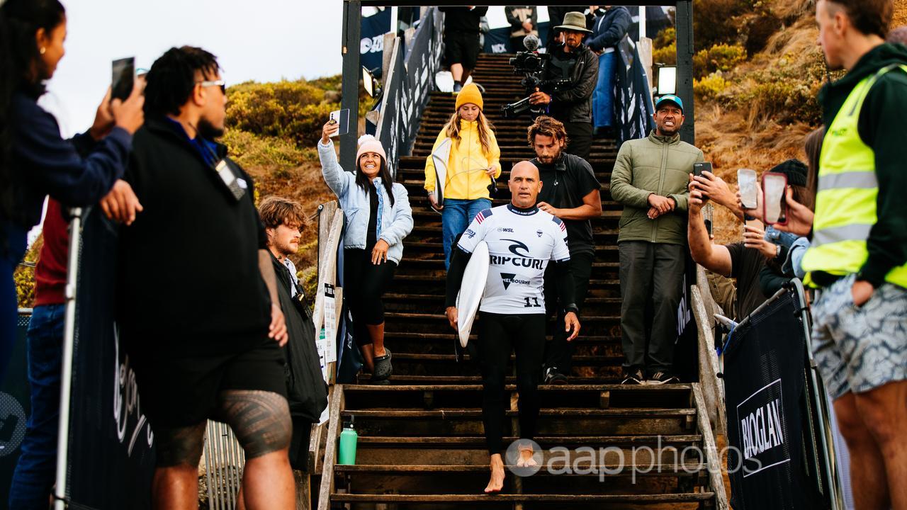 Kelly Slater steps onto the beach at Bells. 